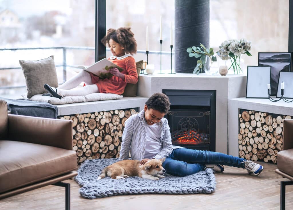 children by the fireplace